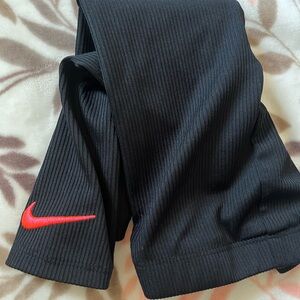 Nike Kids Ribbed Black Leggings with Red Swoosh